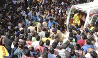 A victim is carried to an ambulance in Indore