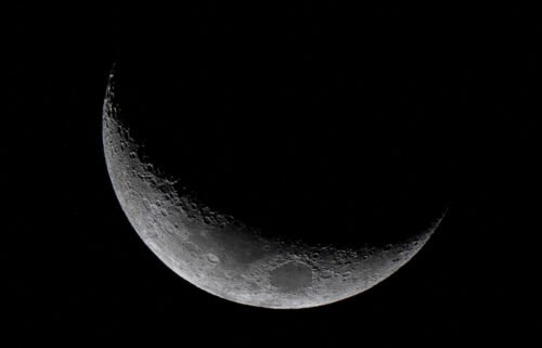The waxing crescent moon is seen from Panama City on March 25.