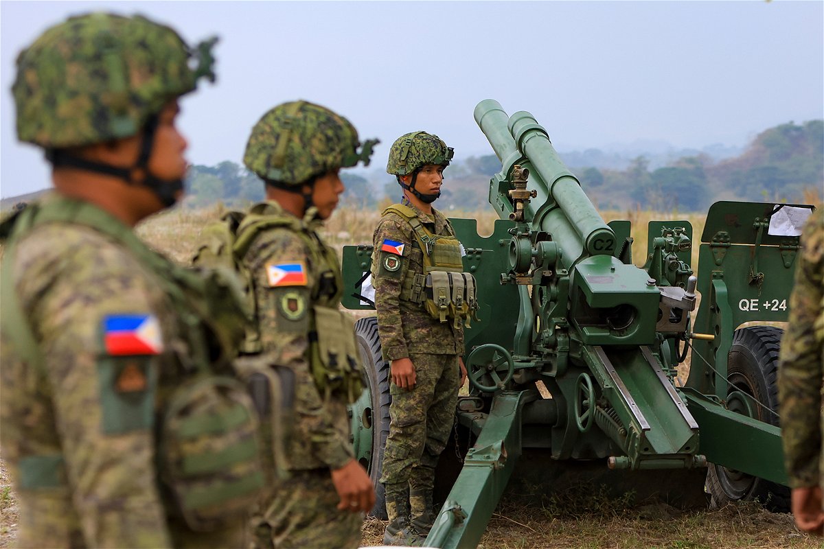 <i>Ceng Shou Yi/NurPhoto/AP</i><br/>Filipino soldiers prepare for shelling during a combined field artillery live-fire exercise as part of the US-Philippines Balikatan military exercises