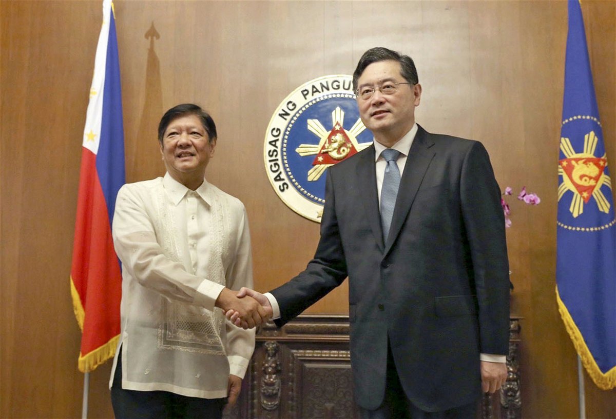<i>KYDPL KYODO/Kyodo/AP</i><br/>Philippine President Ferdinand Marcos Jr. shakes hands with Chinese Foreign Minister Qin Gang during a meeting in Manila on April 22.