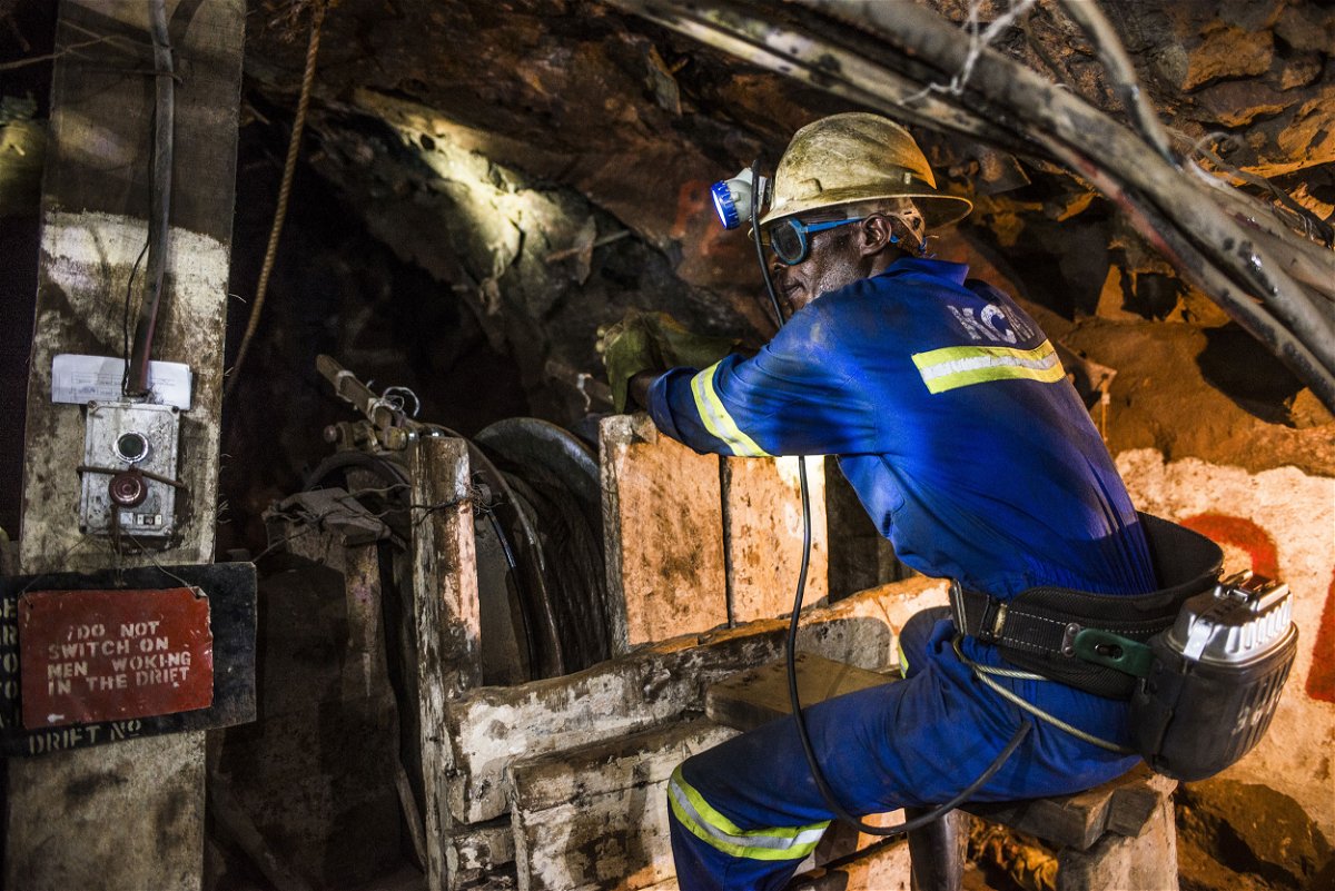<i>Waldo Swiegers/Bloomberg/Getty Images</i><br/>A miner uses a machine to excavate copper ore in an underground tunnel at the Nchanga copper mine