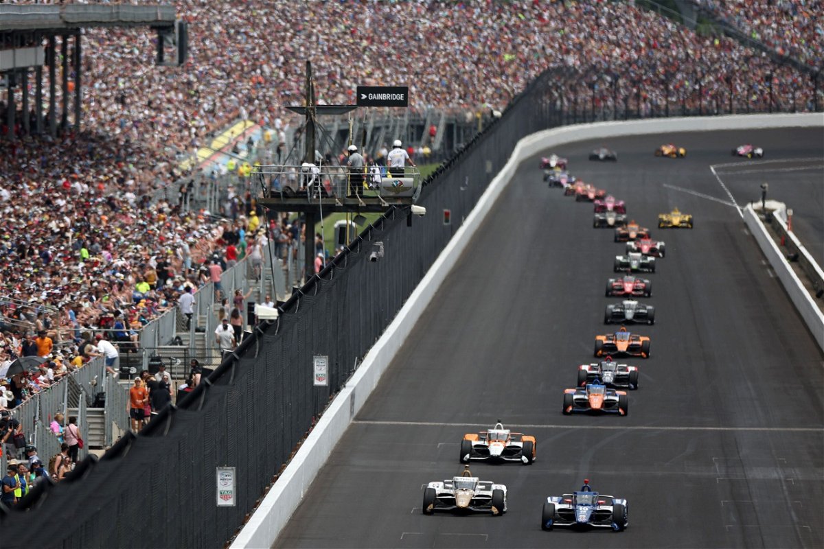 <i>James Gilbert/Getty Images</i><br/>Drivers vie for position early in Sunday's race at the Indianapolis Motor Speedway.