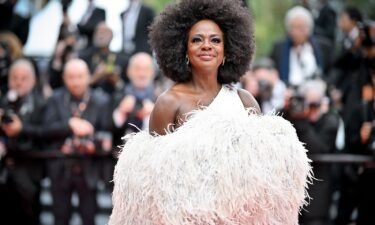 Viola Davis arrived in a Valentino couture feathered cape and white off-the-shoulder dress.