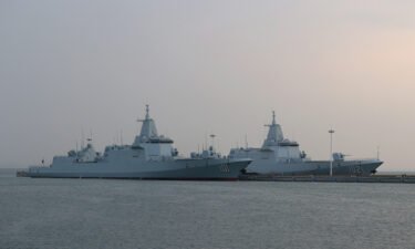 Type 055 guided-missile destroyers Nanchang (101) and Lhasa (102) at China's Qingdao port on  April 20.
