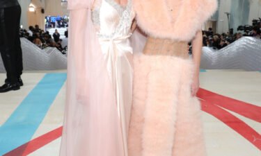 Supermodel Kate Moss and daughter Lila honored Lagerfeld in peachy looks by Fendi couture.