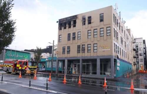 Damage is seen on a hostel building following a fatal fire in Wellington on May 16.