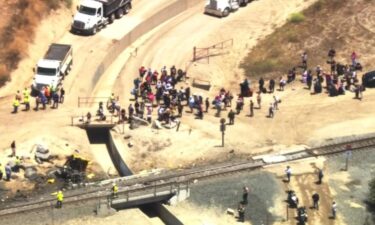 Crews worked through the night and continued Thursday morning to clear a derailed Amtrak train after its collision with a truck in Moorpark the day before. The passenger train crashed into an irrigation truck while pulling seven cars on Wednesday