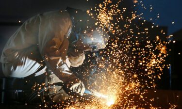 A worker works on a production line at a factory of a ship equipments manufacturer