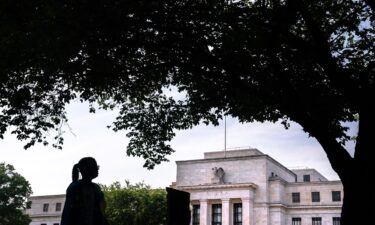 A pedestrian passes the Marriner S. Eccles Federal Reserve building in Washington