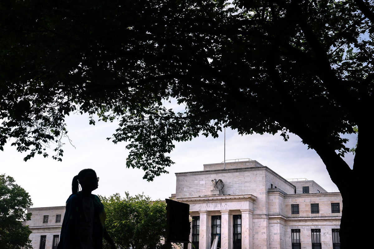 <i>Nathan Howard/Bloomberg/Getty Images</i><br/>A pedestrian passes the Marriner S. Eccles Federal Reserve building in Washington