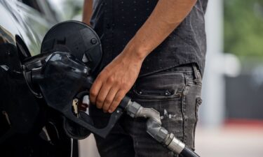 A person pumps gas at a Chevron gas station on May 26 in Austin