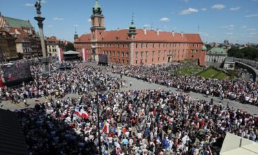 People gather at Old Town as they take part in the march on the 34th anniversary of the first democratic elections in postwar Poland