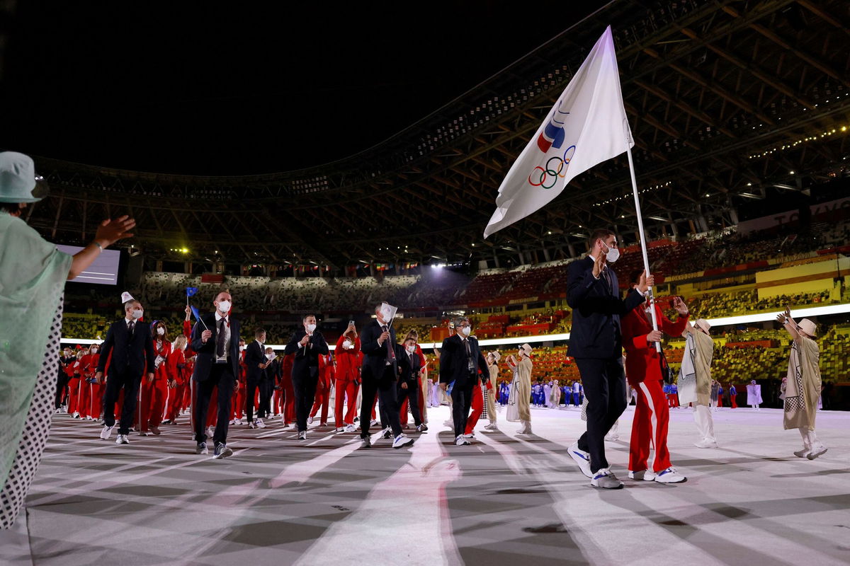 <i>Odd Andersen/AFP/Getty Images</i><br/>Russian athletes participate in the opening ceremony parade during the Tokyo Olympics in 2021.