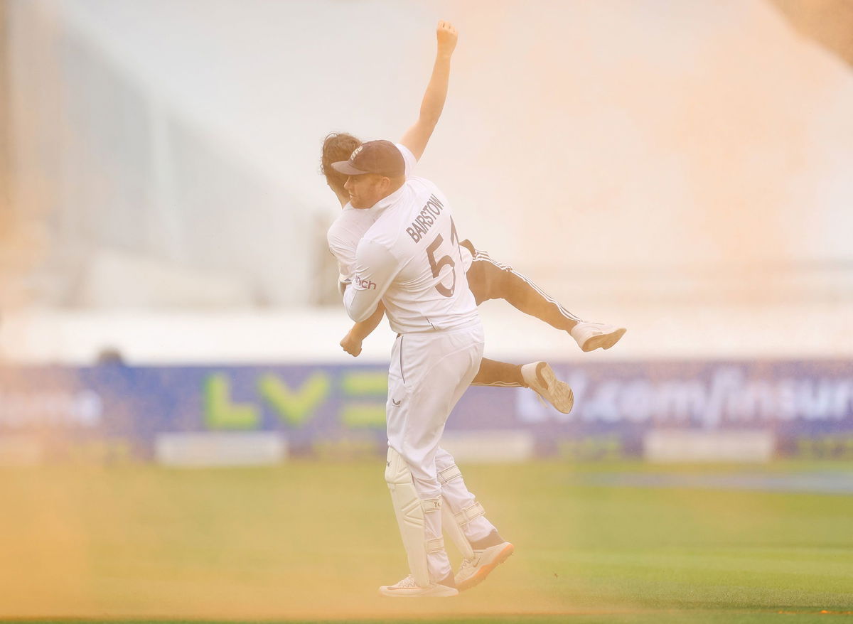 <i>Ryan Pierse/Getty Images</i><br/>Jonny Bairstow picks up a Just Stop Oil protester at Lord's Cricket Ground on June 28.