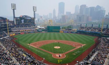 Haze from Canadian wildfires hangs over downtown Pittsburgh and PNC Park during the game.