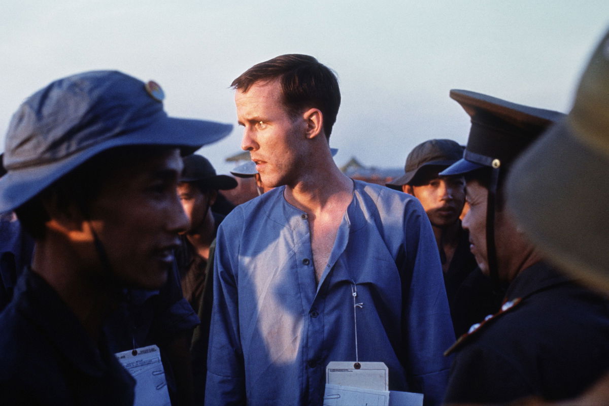 Ken Wallingford is seen in a group of Viet Cong and North Vietnamese Army personnel after his released at Loc Ninh