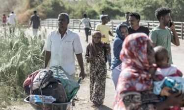 Refugees from Sudan cross into Ethiopia.