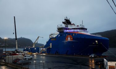 Equipment that was flown in by U.S. Air Force transport planes is loaded onto the offshore vessel Horizon Arctic