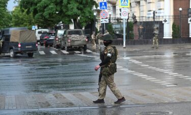 Fighters of Wagner private mercenary group stand guard in a street near the headquarters of the Southern Military District in the city of Rostov-on-Don