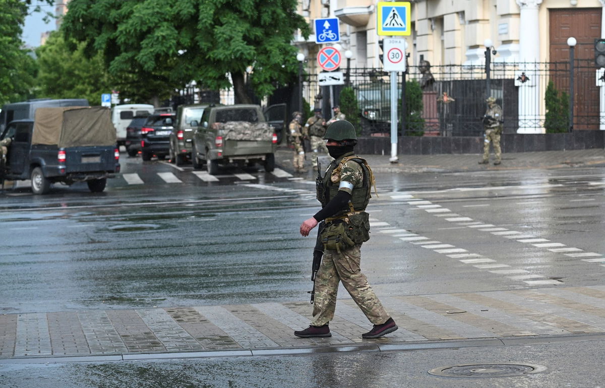 <i>Stringer/Reuters</i><br/>Fighters of Wagner private mercenary group stand guard in a street near the headquarters of the Southern Military District in the city of Rostov-on-Don