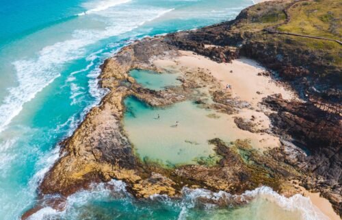 The island's famous Champagne Pools decorate its 75-mile beach.