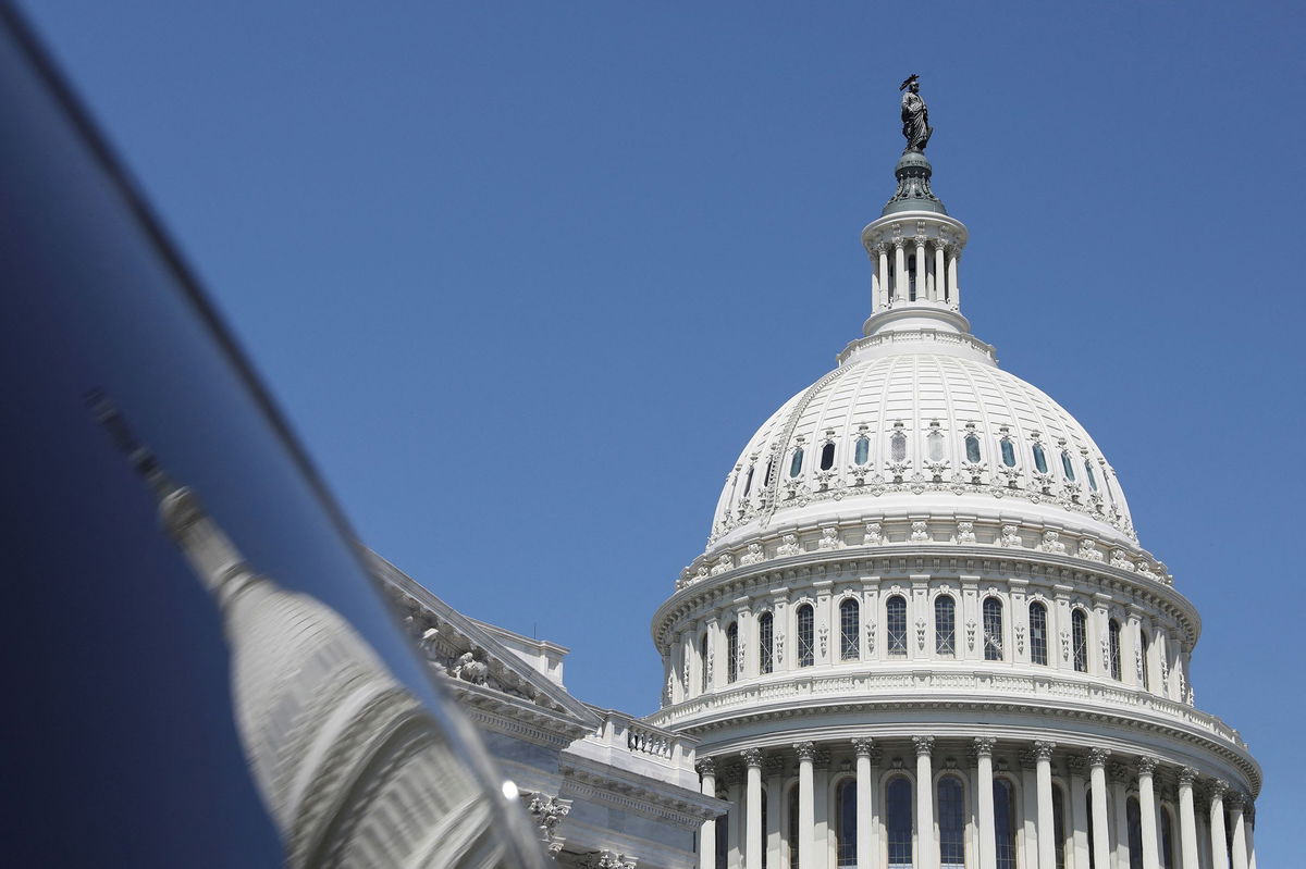 <i>Amanda Andrade-Rhoades/Reuters/FILE</i><br/>The dome of the US Capitol is reflected in a window on Capitol Hill in Washington on April 20.