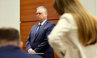 Scot Peterson stands behind the defense table last week during his trial.