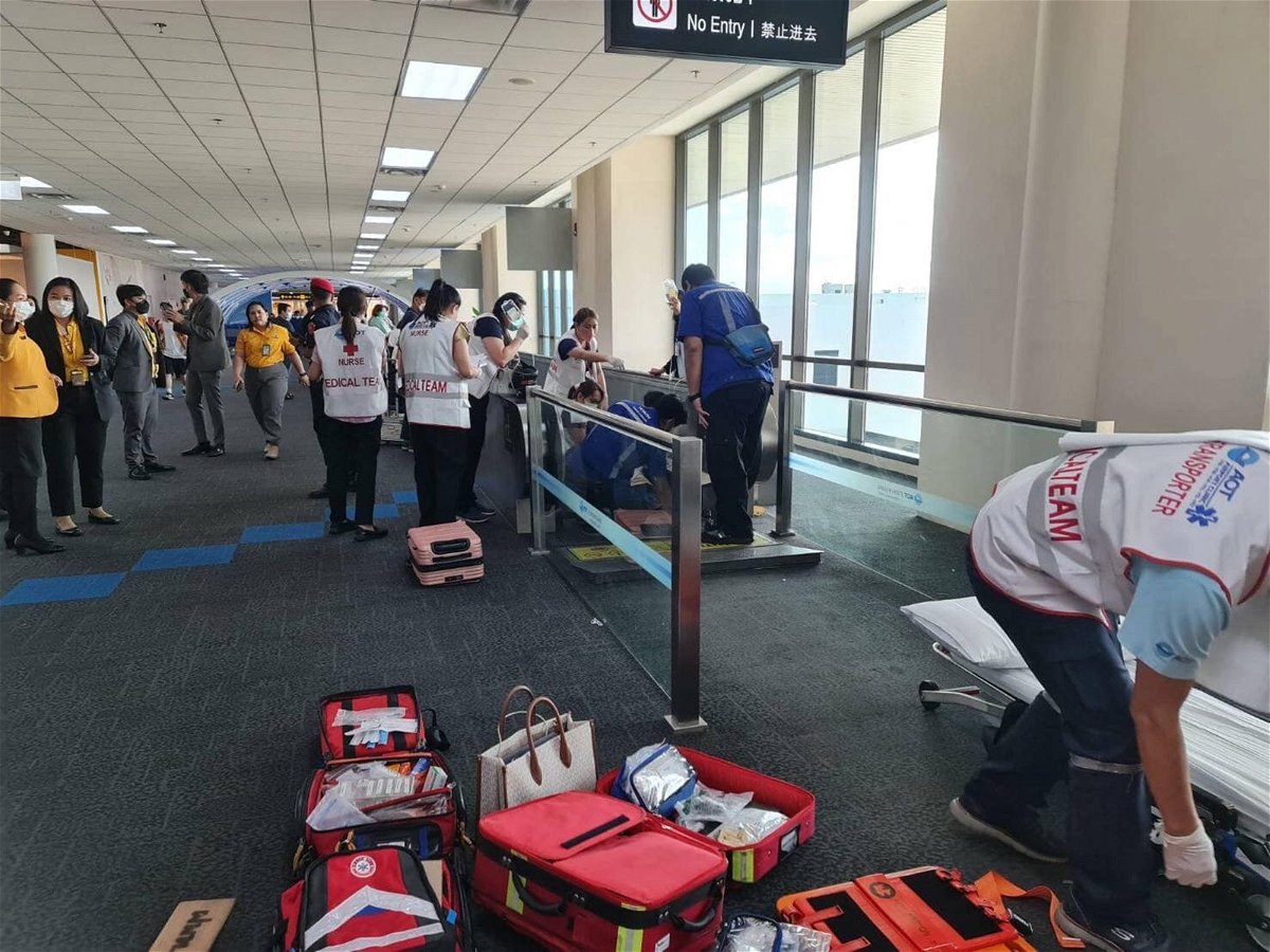 A medical team is deployed to save a woman after her leg gets caught in a moving walkway at Don Mueang International Airport.