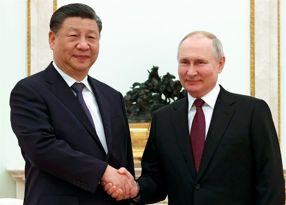 <i>Sergei Karpukhin/AP</i><br/>Chinese President Xi Jinping and Russian President Vladimir Putin pose for a photo during their meeting at the Kremlin in Moscow