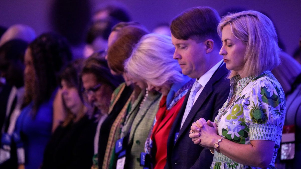 <i>Drew Angerer/Getty Images</i><br/>Attendees bow their heads in prayer at the start of the Faith & Freedom Coalition's policy conference in Washington