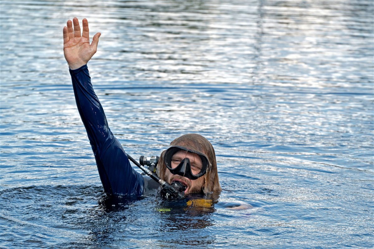 <i>Andy Newman/Florida Keys News Bureau/AP</i><br/>Dr. Joseph Dituri surfaces on June 9 after living for 100 days underwater.