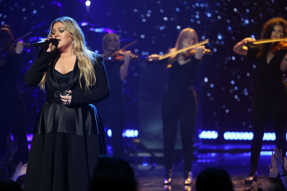 <i>Monica Schipper/Getty Images North America</i><br/>Kelly Clarkson on stage in March. Steve Martin is featured on her new album.