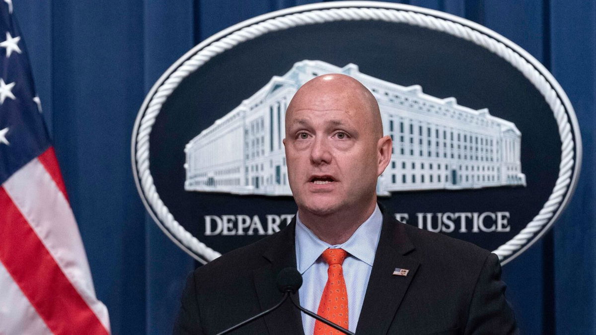 <i>Jose Luis Magana/AP</i><br/>Patrick J. Lechleitner speaks during a news conference at the Department of Justice in Washington