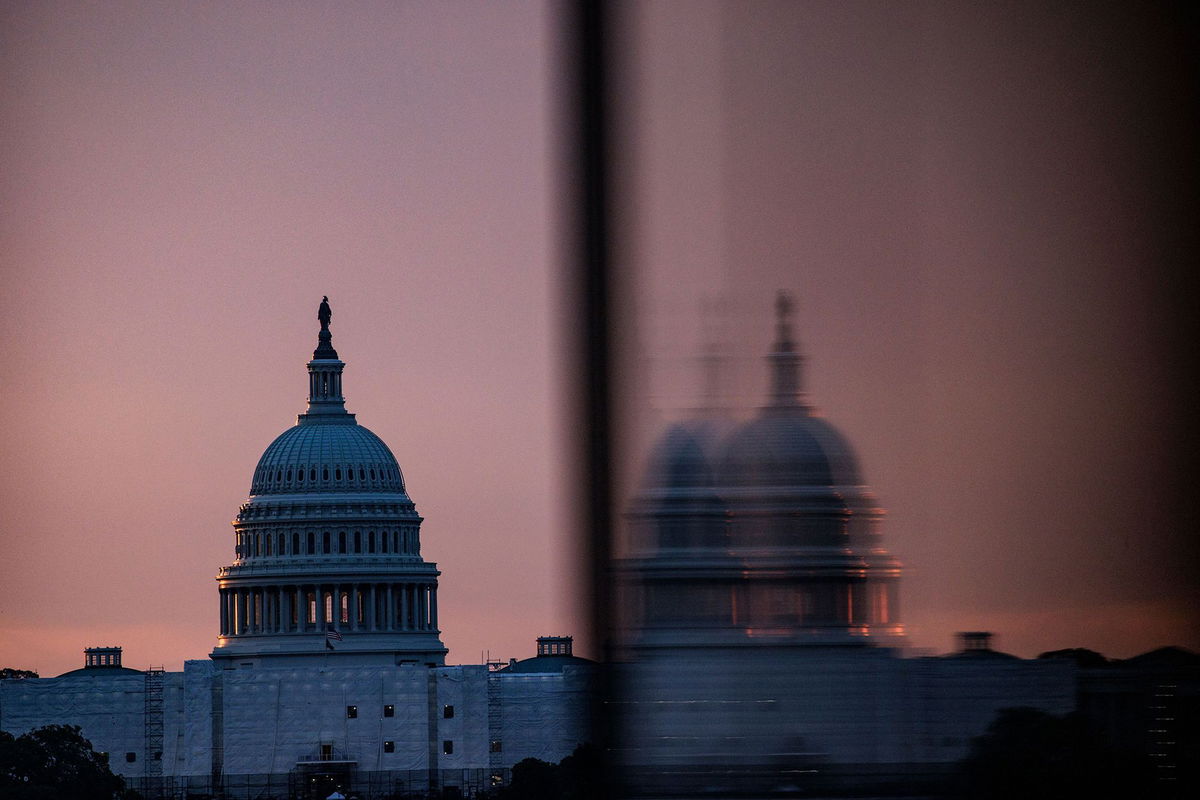 <i>Samuel Corum/AFP/Getty Images</i><br/>The US Capitol building is seen from the base of the Washington Monument as the sun rises in Washington