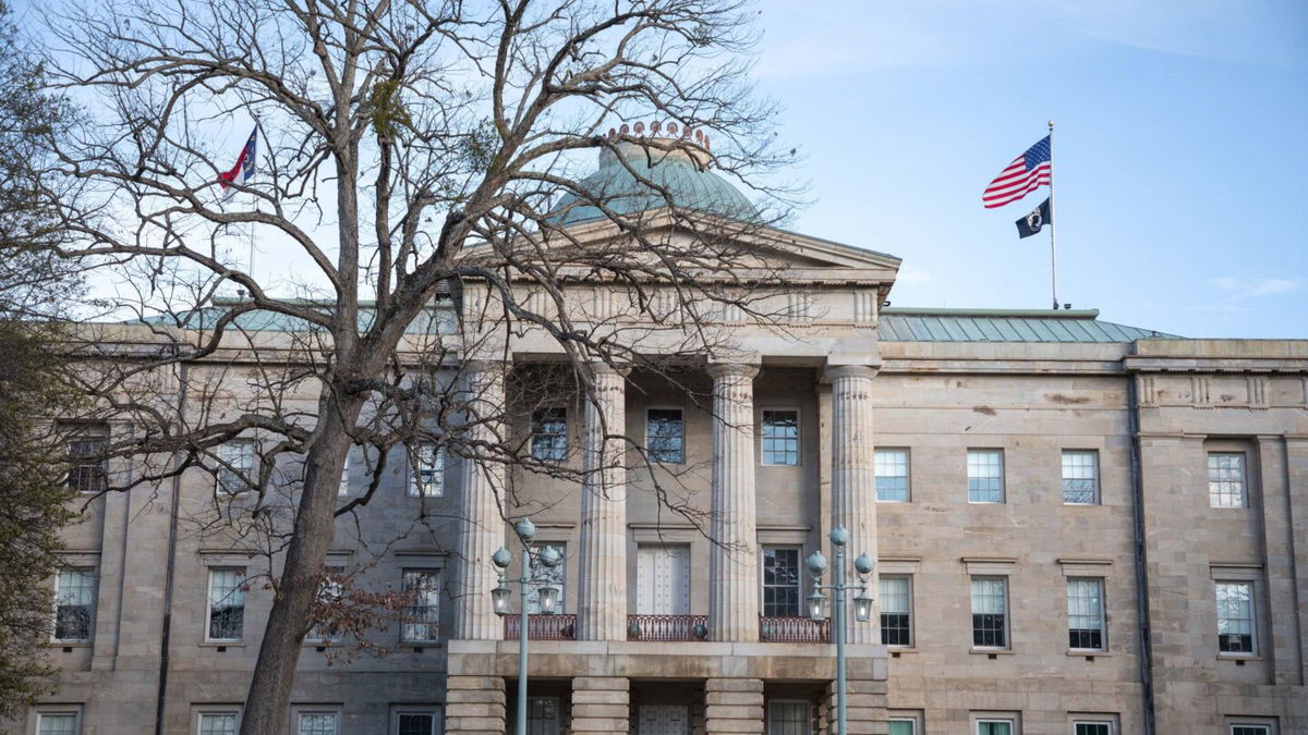 <i>Logan Cyrus/AFP/Getty Images</i><br/>Law enforcement stand guard outside of the state capitol building in Raleigh