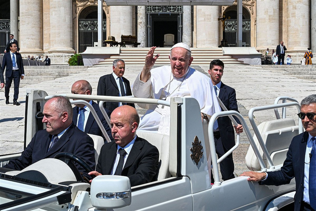 <i>Andreas Solaro/AFP/Getty Images</i><br/>Pope Francis waves from the popemobile in St. Peter's Square in The Vatican on June 7