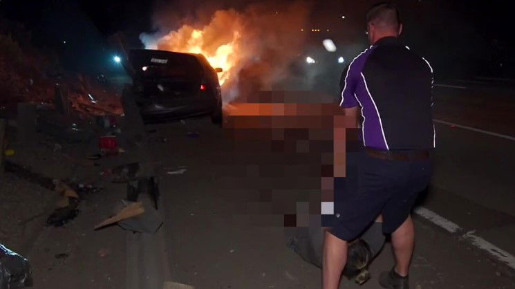 <i></i><br/>A FedEx driver pulled a driver out of a car that crashed and burst into flames on Interstate 15 on July 26.