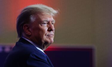 Former President and Republican presidential candidate Donald Trump looks on as he attends the Republican Party of Iowa's Lincoln Day Dinner in Des Moines