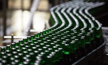 Bottles of Heinken beer travel along the production line at the Heineken NV brewery in Saint Petersburg