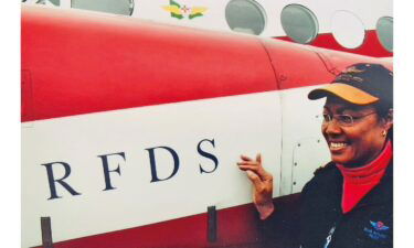 Silva McLeod in front of a Royal Flying Doctor Service plane. She worked for the RFDS as a pilot.