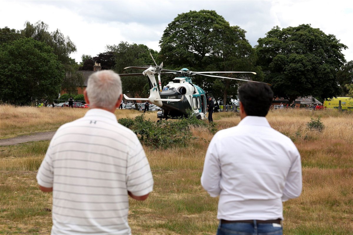 An air ambulance lands on Wimbledon Common in response to the incident.