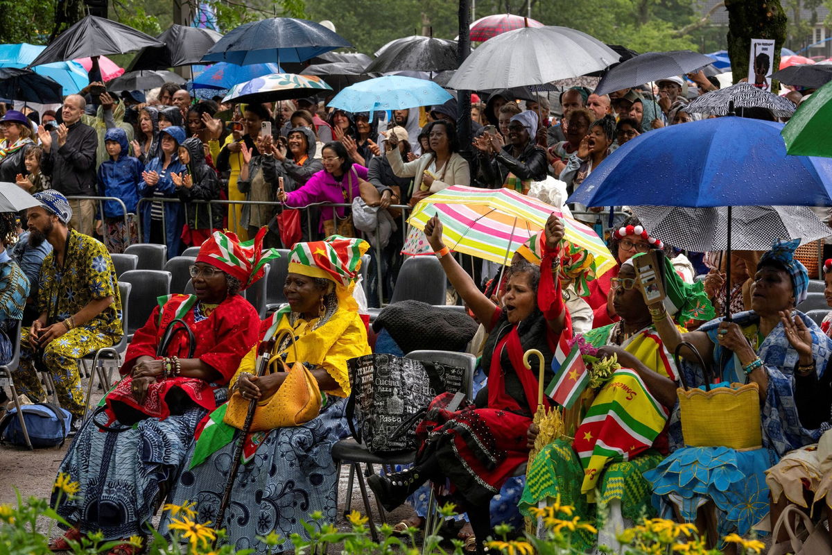 <i>Peter Dejong/Pool/Reuters</i><br/>Spectators react after King Willem-Alexander apologized for the royal house's role in slavery at an event to commemorate the anniversary of the abolition of slavery by the Netherlands on July 1.