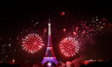 Fireworks explode above the Eiffel Tower as part of the annual Bastille Day celebrations in Paris
