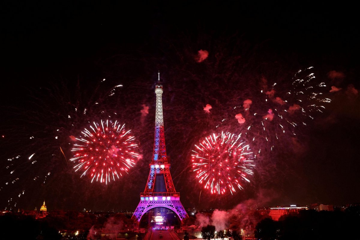 Fireworks explode above the Eiffel Tower as part of the annual Bastille Day celebrations in Paris