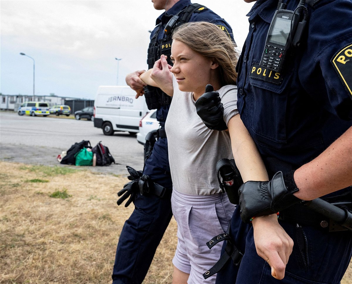 Police remove Greta Thunberg from a climate protest in Malmö