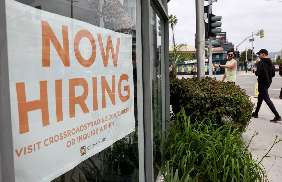 <i>Mario Tama/Getty Images</i><br/>Job openings fell for the third consecutive month. Displayed is a 'Now Hiring' sign outside a resale clothing shop on June 2