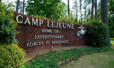 Signage stands on the main gate to Camp Lejeune Marine Base outside Jacksonville