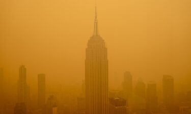 Smoky haze from wildfires in Canada diminishes the visibility of the Empire State Building on June 7 in New York City. Wildfires in Canada that caused smoke to blanket parts of the United States in recent months were linked to a significant rise in emergency hospital visits related to asthma.