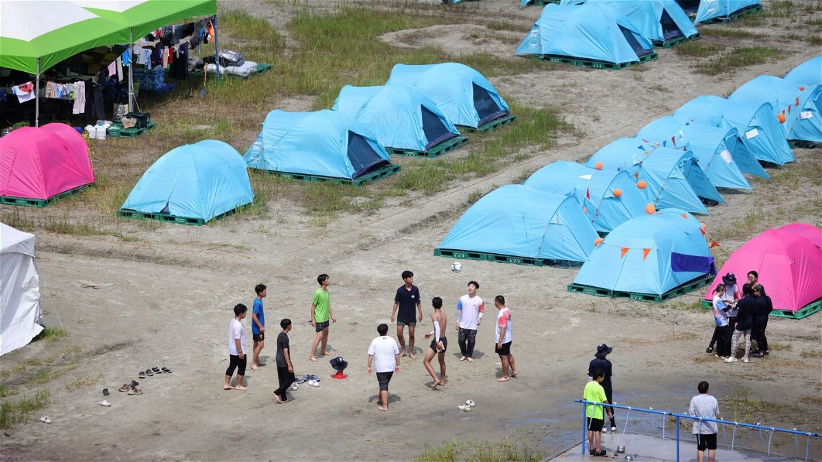 <i>Yonhap News Agency/Reuters</i><br/>Staff for the UK booth of the 25th World Scout Jamboree prepare to leave the site in South Korea on August 5