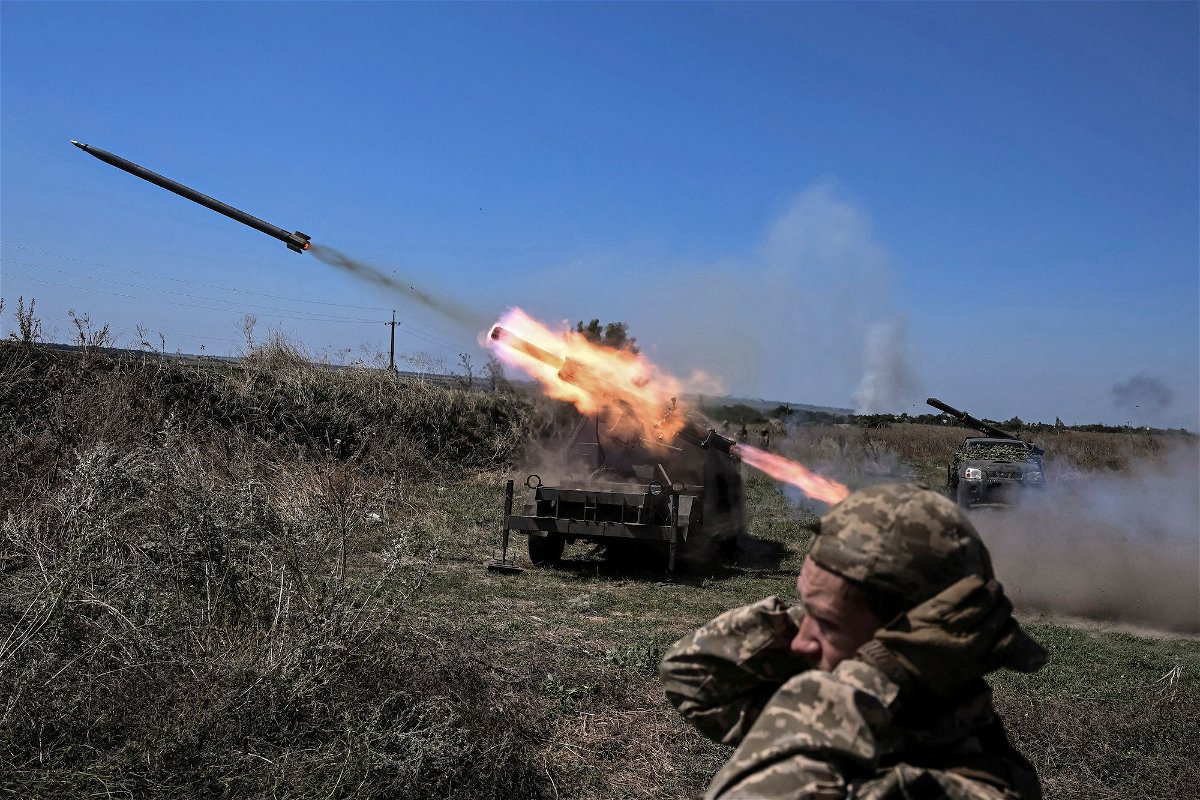 <i>Viacheslav Ratynskyi/Reuters</i><br/>Ukrainian troops fire small multiple launch rocket systems toward Russian forces near a front line in the Zaporizhzhia region on August 19.